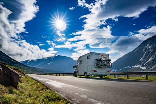 RV on the highway in beautiful landscape