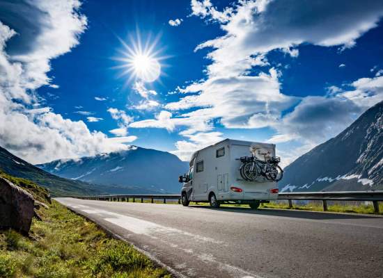 RV on the highway in beautiful landscape