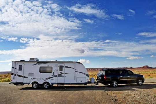 Travel Trailer Pulled by a Large SUV, in Arizona, USA