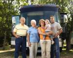 A family standing in front of their RV