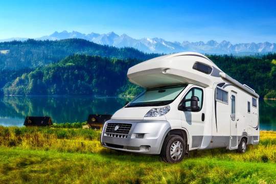 Camper parked near the mountains